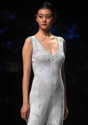 Chinese and European models wear clothing from the Lotus 2017 collection during China s international fashion week in Beijing on October 31, 2016. Chinese fashion designers are becoming an international force with both European and American fashion houses looking at the new, fresh Chinese clothing-minds as potential partners in future clothing brands.  PEK2016103110 STEPHENxSHAVER