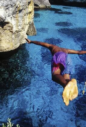 Cliff Diving at Negril, Jamaica.  Copyright: xGregxJohnstonx xDanitaxDelimont CA22 GJO0091