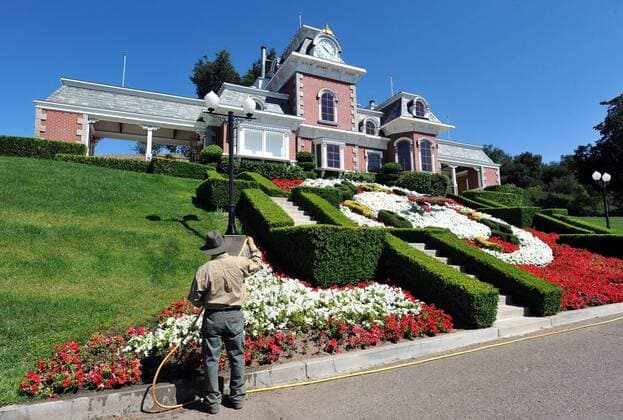 Jul. 2, 2009 - Los Olivos, California, USA - The media gets a rare look inside Neverland Ranch, residence of the late Michael Jackson from 1988-2005. - PICTURED: Groundskeepers water flowers near the Neverland Train Station. This is a miniature version of the train station at Disneyland. ( - ZUMAb77_ 20090702_mda_b77_895