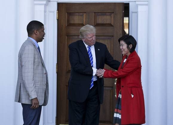 President-elect Donald Trump (C) greets Mayor of Sacramento, California, Kevin Johnson (L) and former chancellor of Washington, DC public schools Michelle Rhee (R), at the clubhouse of Trump International Golf Club, November 19, 2016 in Bedminster Township, New Jersey. Pool photo by Aude Guerrucc  TPX20161119214 AUDExGUERRUCCI