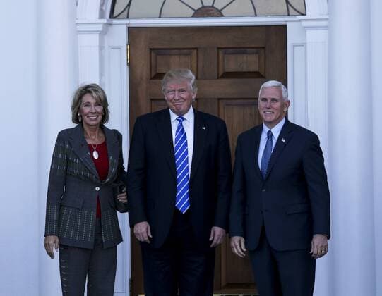 November 19, 2016 - Bedminster Township, New Jersey, United States of America - United States President-elect Donald Trump (C) and Vice President-elect Mike Pence (R) pose with Betsy DeVos at the clubhouse of Trump International Golf Club, November 19, 2016 in Bedminster Township, New Jersey. .Credit: Pool via CNP Bedminster Township United States of America - ZUMAs152 20161119_zaa_s152_002