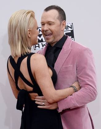 Actress Jenny McCarthy (L) and recording artist Donnie Wahlberg arrive for the 2016 American Music Awards held at Microsoft Theater in Los Angeles on November 20, 2016.  LAP20161120134 JIMxRUYMEN