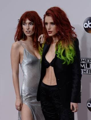 Actresses Dani Thorne (L) and Bella Thorne arrive for the 2016 American Music Awards held at Microsoft Theater in Los Angeles on November 20, 2016.  LAP20161120226 JIMxRUYMEN