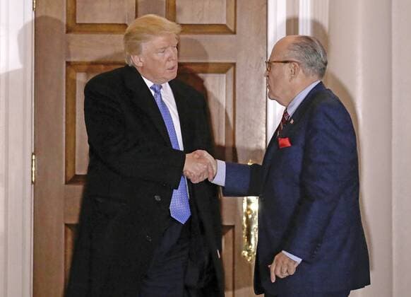 November 20, 2016 - Bedminster Township, New Jersey, United States of America - Former New York City Mayor Rudy Giuliani (R) shakes hands with United States President-elect Donald Trump at the clubhouse of Trump International Golf Club, in Bedminster Township, New Jersey, USA, 20 November 2016..Credit: Pool via CNP Bedminster Township United States of America - ZUMAs152 20161120_zaa_s152_033