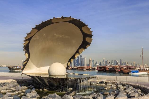 Pearl Monument with moored dhows and modern city skyline of West Bay, from Al-Corniche, Doha, Qatar, Middle East Copyright: EleanorxScriven 1167-1011