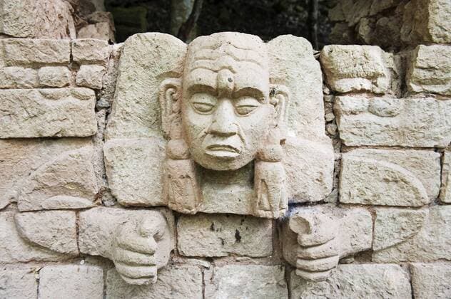 Sculpted head stone at Mayan archeological site, Copan Ruins, UNESCO World Heritage Site, Honduras, Central America Copyright: ChristianxKober 733-4910
