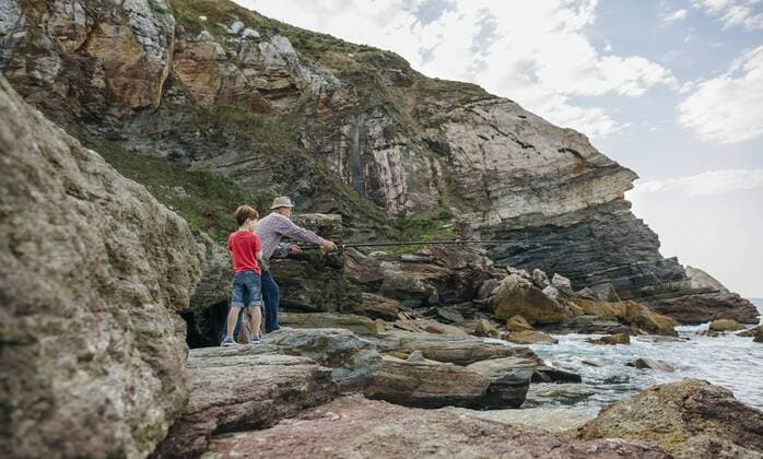 Grandfather and grandson fishing together at the sea model released Symbolfoto  DAPF00416