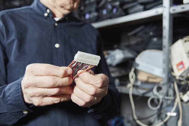 Man holding motherboard connector model released Symbolfoto property released  RKNF00440