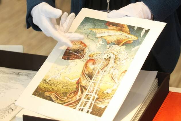 A saleswoman at Liber Publishing shows one of the most expensive books in its catalog, during the fifth day of the 30th edition of the Guadalajara International Book Fair (FIL). In the city of Guadalajara, Mexico, 30 November 2016. Understanding the book as a jewel is the key to the success of the Spanish Liber Editions, which these days presents in the FIL of Guadalajara several of their copies, authentic museum pieces cared for with total affection and with prices, this too, within reach of very few. UNDERSTAND THE BOOK AS A PIECE OF MUSEUM, SUCCESS KEY FOR SPANISH EDITORIAL !ACHTUNG: NUR REDAKTIONELLE NUTZUNG!  20161130-636161247230756847