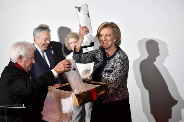 Lee Roy Mitchell, Founder and Chairman of the Board Cinemark hand out boots to Princess Astrid of Belgium pictured during a visit to Cinemark on the fourth day of the economic mission of Belgium s Princess Astrid in Texas, United States, Tuesday 06 December 2016, in Austin.  DIRKxWAEM 04991765