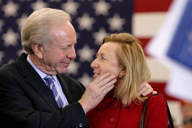 Feb 03, 2008 - Fairfield, Connecticut, USA - Senator JOE LIEBERMAN (I-CT) listens intently to his wife HADASSAH LIEBERMAN during an appearance by John McCain at Sacred Heart University in Fairfield, CT. Most polls have McCain ahead of closest contender Mitt Romney before Super Tuesday. - ZUMAg28_ 20080203_nar_g28_632
