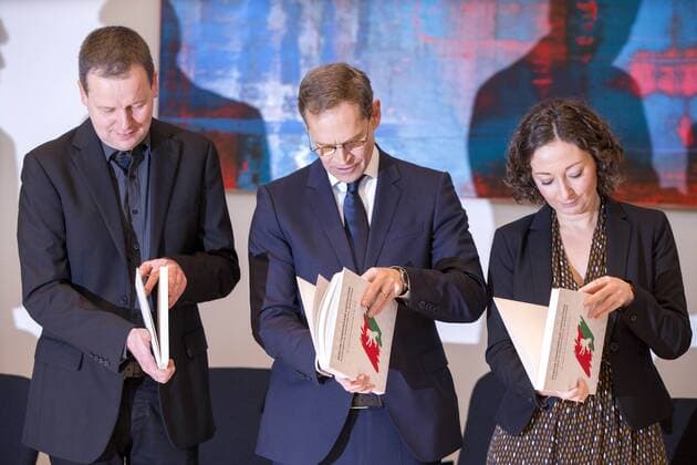 December 8, 2016 - Berlin, Germany - Berlin s designated Mayor Michael Mueller (C, SPD), Klaus Lederer (Die Linke, L) and Ramona Pop (Die Gruenen, R) hold a copy of the coalition agreement between SPD, Die Linke (left party) and Buendnis 90 - Die Gruenen (green party) after the signing ceremony, marking the start of the so called new red-red-green (Rot-Rot-Gruen) government of Berlin, in the Abgeornetenhaus in Berlin, Germany on Dezember 8, 2016. Berlin Germany  - ZUMAn230 20161208_zaa_n230_197