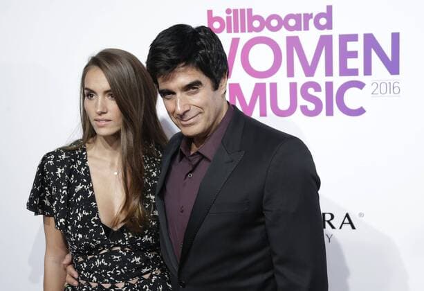 Chloe Gosselin and illusionist David Copperfield arrives on the red carpet at the Billboard Women in Music 2016 event on December 9, 2016 in New York City.  NYP20161209137 JOHNxANGELILLO