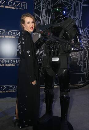 MOSCOW, RUSSIA - DECEMBER 14, 2016: Russian TV presenter and journalist Ksenia Sobchak (L) poses for a photograph with an actor dressed as a stormtrooper at the Moscow premiere of Rogue One: A Star War Story, a film by Gareth Edwards, in Moscow s Tesla 4000 multi-format workspace. Vyacheslav Prokofyev TASS  TS03AFA5