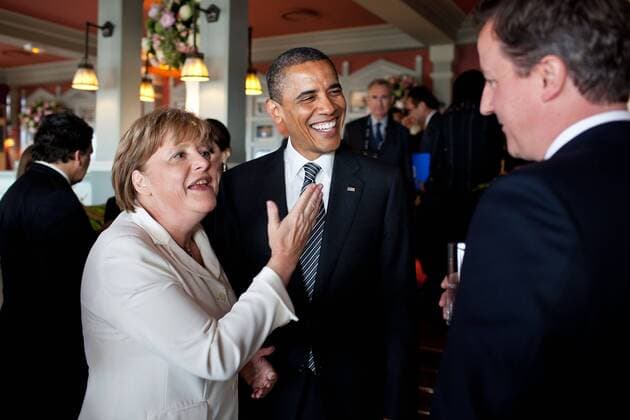 May 26, 2011 - Deauville, France - US President Barack Obama talks with German Chancellor Angela Merkel and British Prime Minister David Cameron before the start of the working G8 dinner May 26, 2011 in Deauville, France. Deauville. France - ZUMAz03_ 20110526_shm_z03_817