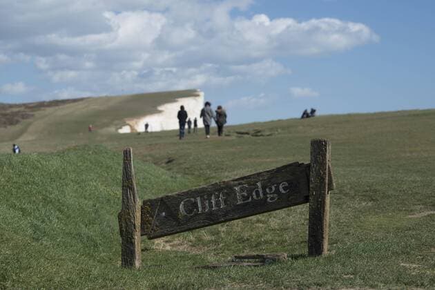 A warning sign near the cliffs at Beachy Head on the south coast, South Downs National Park, East Sussex, England, United Kingdom, Europe Copyright: AlexxTreadway 1225-1020