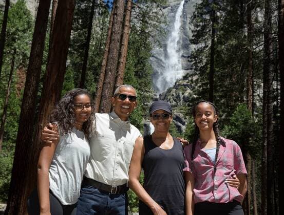 June 19, 2016 - Yosemite, CA, United States of America - U.S President Barack Obama poses for a family photo with daughters Malia Obama & Sasha Obama and First Lady Michelle Obama in front of the 2,400-foot Yosemite Falls July 19, 2016 in Yosemite National Park, California. Barack Hussein Obama II (born August 4, 1961) is the 44th President of the United States. He is the first African American to be elected to office and the first president born outside the contiguous United States. Born in Honolulu, Hawaii, Obama is a graduate of Columbia University and Harvard Law School. He worked as a civil rights attorney and taught constitutional law at the University of Chicago Law School from 1992 to 2004. While serving three terms representing the 13th District in the Illinois Senate from 1997 to 2004, he ran unsuccessfully in the Democratic primary for the United States House of Representative - ZUMAz03_ 20160619_shs_z03_153
