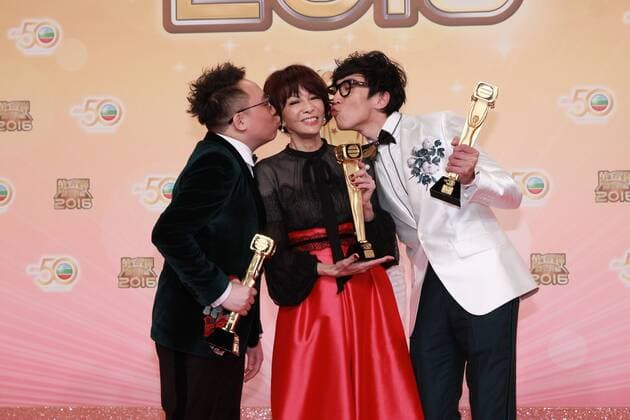 HONG KONG, CHINA - DECEMBER 18: Host Do Do Carol Cheng (C) celebrates with partners hip-hop group FAMA at the backstage of the 2016 TVB Anniversary Awards on December 18, 2016 in Hong Kong, China.  CFP497275748