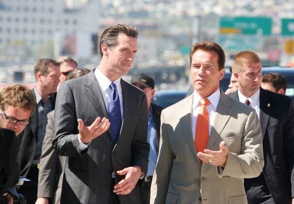 Gavin Newsom, Mayor of San Francisco, and govenor Arnold Schwarzenegger talk as they walk to the press conference for the opening of the Western Approach to the Bay Bridge in San Franicsco Friday morning, april 11, 2008. (Laura A. Oda The Oakland Tribune)  - ZUMAACH 20080411_zaf_o23_002