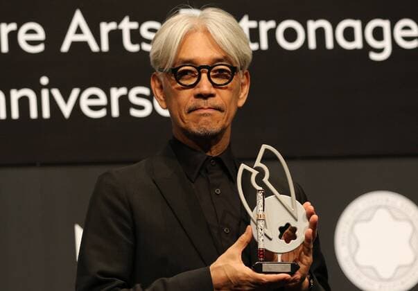 December 21, 2016, Tokyo, Japan - Japanese composer Ryuichi Sakamoto, a member of the Yellow Magic Orchestra (YMO) displays a special fountain pen after he received Montblanc de la Culture Arts Patronage Award in Tokyo on Wednesday, December 21, 2016. Sakamoto played his screen music Merry Christmas Mr. Lawrence with young musicians.  (lwxa006999)