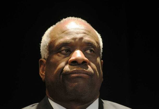 Supreme Court Justice Clarence Thomas listens during the graduation ceremony of Washington Jesuit Academy in NE Washington D.C., Thursday, May 29, 2008. Thomas was on hand to give the graduation commencement speech - ZUMAw85_ 20080110_zaf_w85_139