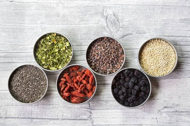 Bowls of chokeberries, chia, cocoa, quinoa, moringa and wolfberries  SARF03105