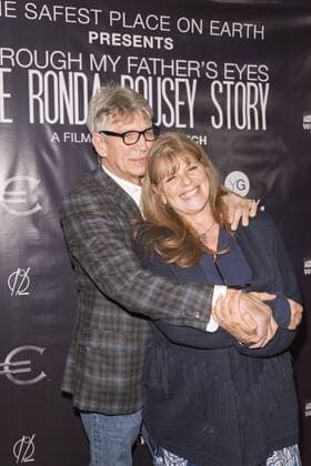 Eric Roberts and wife Eliza attend at The Ronda Rousey Story film premiere December 30, 2016 in Chinese Mann Theater, Hollywood, California. USA - 2016 - The Ronda Rousey Story film premiere in Hollywood, CA.  Copyright: xEugenexPowersxPhotographyx
