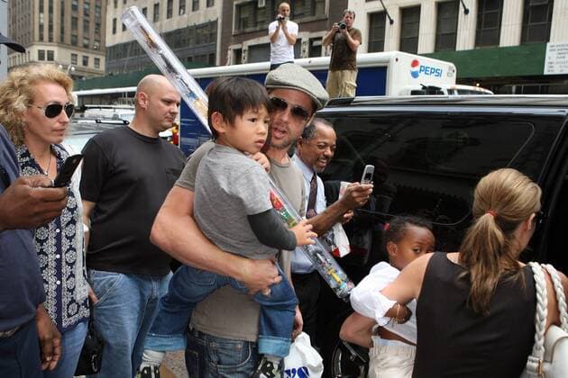 August 24 2007, New York City Angelina Jolie and Brad Pitt took their adopted children Zahara, Pax and Maddox for a trip to Lee s Art Shop in midtown Manhattan, bought them toys and gifts and then stopped in Times square on the way back to their hotel, where Brad bought Maddox a pretzel - ZUMAny2_ 20070824_zaf_ny2_027