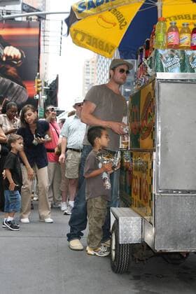 August 24 2007, New York City Angelina Jolie and Brad Pitt took their adopted children Zahara, Pax and Maddox for a trip to Lee s Art Shop in midtown Manhattan, bought them toys and gifts and then stopped in Times square on the way back to their hotel, where Brad bought Maddox a pretzel - ZUMAny2_ 20070824_zaf_ny2_039