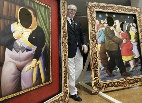 May 23, 2007 - San Antonio, TX, USA - Fernando Botero wanders past cut-outs of some of his paintings at a celebration in his honor at the San Antonio Library, in San Antonio, Texas. Fernando Botero is a neo-figurative Colombian artist, self-titled the most Colombian of Colombian artists. He won the first prize at the Sal—n de Artistas Colombianos in 1958, He paints and draws in a style somewhat similar to Pablo Picasso. He strives in all his work to capture an essential part of himself and his subjects through color and form. His work includes still-life and landscapes, but Botero tends to primarily focus on situational portraiture. His paintings and sculptures are, on first examination, noted for their exaggerated proportions and the corpulence of the human figures and animal figures. - ZUMAa27_ 20070523_rnn_a74_028