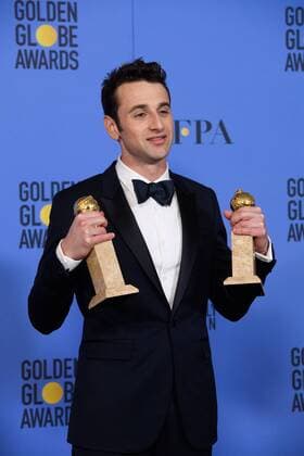 Jan 8, 2017 - Beverly Hills, California, U.S - After winning the categories of BEST ORIGINAL SCORE and BEST ORIGINAL SONG MOTION PICTURE for La La Land, JUSTIN HURWITZ poses with the awards backstage in the press room at the 74th Annual Golden Globe Awards at the Beverly Hilton in Beverly Hills, CA on Sunday, January 8, 2017. Beverly Hills U.S - ZUMAz03_ 20170108_sha_z03_478