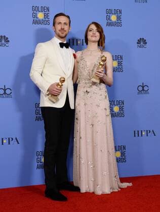 Ryan Gosling and Emma Stone, winners of the awards for Best Performance by an Actor and Actress in a Motion Picture Musical or Comedy respectively for La La Land appear backstage with their trophies during the 74th annual Golden Globe Awards at the Beverly Hilton Hotel in Beverly Hills, California on January 8, 2017.  LAP201701084011 JIMxRUYMEN