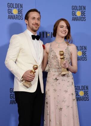 Ryan Gosling and Emma Stone, winners of the awards for Best Performance by an Actor and Actress in a Motion Picture Musical or Comedy respectively for La La Land appear backstage with their trophies during the 74th annual Golden Globe Awards at the Beverly Hilton Hotel in Beverly Hills, California on January 8, 2017.  LAP201701084010 JIMxRUYMEN