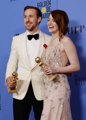 Ryan Gosling and Emma Stone, winners of the awards for Best Performance by an Actor and Actress in a Motion Picture Musical or Comedy respectively for La La Land appear backstage with their trophies during the 74th annual Golden Globe Awards at the Beverly Hilton Hotel in Beverly Hills, California on January 8, 2017.  LAP201701084022 JIMxRUYMEN