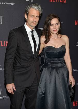 Winona Ryder (R) and Scott Mackinlay Hahn arrive at the Weinstein Company and Netflix 2017 Golden Globes after party at the Beverly Hilton in Beverly Hills, California on January 8, 2017.  LAP201701082036 CHRISTINExCHEW
