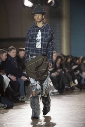 London: Vivienne Westwood Fashion Show Vivienne Westwood s runway at LFW Men s January 2017. A model walks the runway at the Vivienne Westwood show during London Fashion Week Men s collections at Seymour Leisure Centre. Dame Vivienne Isabel Westwood is a British fashion designer and businesswoman, largely responsible for bringing modern punk and new wave fashions into the mainstream. Westwood came to public notice when she made clothes for Malcolm McLaren s boutique in the King s Road, which became famous as SEX  AlbertoxPezzali