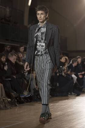 London: Vivienne Westwood Fashion Show Vivienne Westwood s runway at LFW Men s January 2017. A model walks the runway at the Vivienne Westwood show during London Fashion Week Men s collections at Seymour Leisure Centre. Dame Vivienne Isabel Westwood is a British fashion designer and businesswoman, largely responsible for bringing modern punk and new wave fashions into the mainstream. Westwood came to public notice when she made clothes for Malcolm McLaren s boutique in the King s Road, which became famous as SEX  AlbertoxPezzali