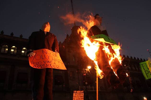 January 9, 2017 - Mexico City, Mexico - Demonstrators burned a figure of Donald Trump, and the Mexican President Enrique PeoÂ±a Nieto in front of Nacional Palace of Mexico City, on 9 January 2017, as a part of the demonstration against fuel prices in all the country. Largely peaceful protests against the fuel price increases continued nationwide in Mexico, and looting seen last week largely subsided. The protests have left hundreds of businesses looted and more than 1,500 detained. Mexico City Mexico  - ZUMAn230 20170109_zaa_n230_043