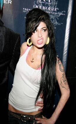 Mar 23, 2007 - Hollywood, CA, USA - AMY WINEHOUSE, singer at Celebrity Blogger Perez Hilton s 29th Birthday Ball held at the Roxy Theater on Sunset. Amy Jade Winehouse (born September 14, 1983) is an English jazz and soul singer and songwriter from Enfield, North London. Her debut album, Frank (released in 2003) was nominated for the Mercury Music Prize and she won an Ivor Novello award in 2004 for her debut single Stronger than Me . In 2006, she released her second album, Back to Black. On 14 February 2007, she won a Brit award for Best British Female Artist.  - ZUMA 20070323_cze_z14_046
