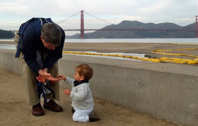 November 12th, 2007 - San Francisco, California, USA - Richard Best visits Crissy Field with his grandson Andrew James, 11 months old, Monday, Nov. 12, 2007, where a press conference addresses the oil spill into San Francisco Bay last week on Nov. 7. The containment barriers line the shore of East Beach.  - ZUMA5_jc 20071112_zaf_c99_004