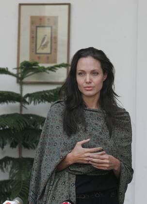 Nov 05, 2006 - New Delhi, India - Hollywood actress and UNHCR good-will ambassador, ANGELINA JOLIE (C) arrives at Hyderabad House to meet Indian Minister of State for External Affairs, Anand Sharma in New Delhi. Jolie, who is in New Delhi for two days to work with the UN refugee agency, met with refugee women and children from Myanmar and also the Khalsa Diwan Welfare Society, an organization run by and for Sikh Afghan refugees in India. - ZUMAp74_ 20061105_rua_p74_226