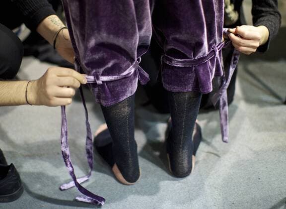 MILAN, Jan. 16, 2017 -- A model has his clothes changed at backstage ahead of the Fall Winter 2017 18 menswear collection of MIAORAN during Milan Fashion Week in Milan, Italy, on Jan. 16, 2017. )(gl) ITALY-MILAN-FASHION WEEK-MEN-CHINESE DESIGNER-MIAORAN JinxYu 