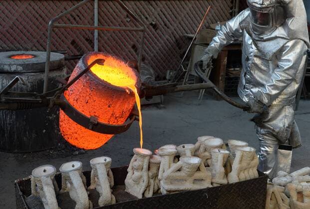Workers in fire suits pour molten bronze metal into molds during the casting of the Screen Actors Guild Award statuettes at the American Fine Arts Foundry in Burbank, California on January 17, 2017. Winners are to be announced during a live simulcast on TNT and TBS in Los Angeles on January 29, 2017.  LAP2017011703 JIMxRUYMEN