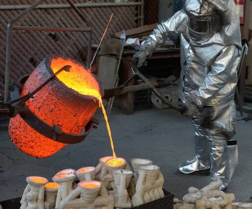 Workers in fire suits pour molten bronze metal into molds during the casting of the Screen Actors Guild Award statuettes at the American Fine Arts Foundry in Burbank, California on January 17, 2017. Winners are to be announced during a live simulcast on TNT and TBS in Los Angeles on January 29, 2017.  LAP2017011711 JIMxRUYMEN