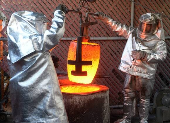 Workers in fire suits pour molten bronze metal into molds during the casting of the Screen Actors Guild Award statuettes at the American Fine Arts Foundry in Burbank, California on January 17, 2017. Winners are to be announced during a live simulcast on TNT and TBS in Los Angeles on January 29, 2017.  LAP2017011702 JIMxRUYMEN