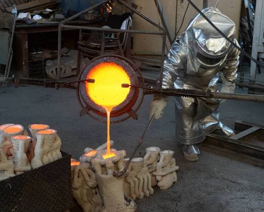 Workers in fire suits pour molten bronze metal into molds during the casting of the Screen Actors Guild Award statuettes at the American Fine Arts Foundry in Burbank, California on January 17, 2017. Winners are to be announced during a live simulcast on TNT and TBS in Los Angeles on January 29, 2017.  LAP2017011709 JIMxRUYMEN