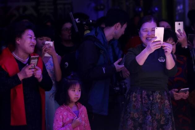 Shenyang, China - Shenyang, CHINA-January 14 2017: (EDITORIAL USE ONLY. CHINA OUT) ..Women take photos of the male models walking on the runway during a fake Victoria s Secret fashion show in Shenyang, northeast China s Liaoning Province. A plastic surgery hospital held the Victoria s Secret Fashion Show , hiring models to wear wings and lingerie during the show, which attracted many people. Shenyang China  - ZUMAs145 20170118_zaa_s145_026