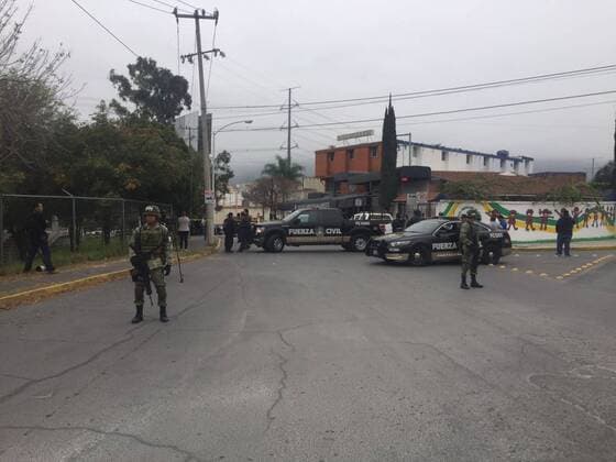 (170118) -- MONTERREY (MEXICO), Jan. 18, 2017 -- Security members stand guard near the American School of the Northeast, where a shooting occurred, in Monterrey, Nuevo Leon state, Mexico, on Jan. 18, 2017. At least five people, including four teenagers and one teacher, were critically injured early Wednesday, after a student opened fire in their classroom at the private school. ) MEXICO-MONTERREY-SCHOOL-SHOOTING ABCxNewspaper