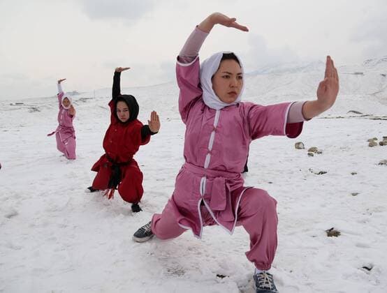 KABUL, Jan. 18, 2017 -- Afghan girls from Shaolin club perform Wushu on the top of a hill in Kabul, capital of Afghanistan, Jan. 18, 2017. There are 20 Afghan girls learn Wushu in the Shaolin Wushu club in Kabul. Most of them are students. The eldest girl among them is 20 years old, and the youngest one is only 13 years old. They have been practicing this martial sport for almost two years. ) (SP)AFGHANISTAN-KABUL-WOMEN-WUSHU RahmatxAlizadah 