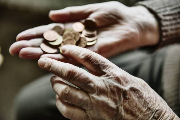 Senior woman s hands with coins model released Symbolfoto  JATF00945